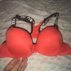 Orange push-up PINK sports bra.